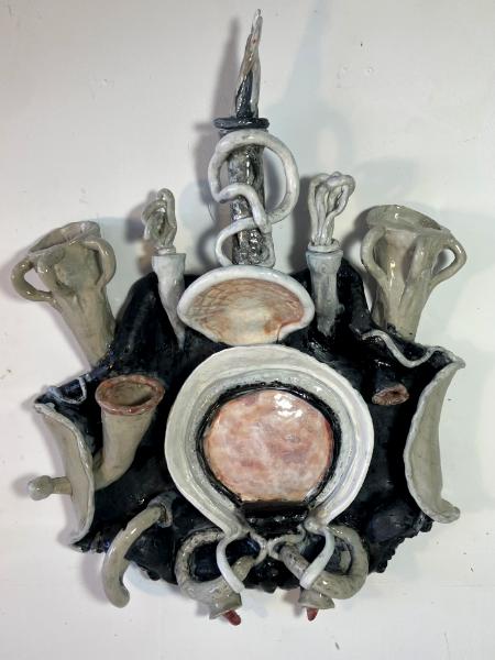 18" tall, gray wall sculpture