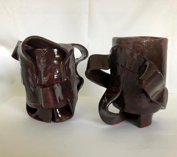 two brown ceramic mugs